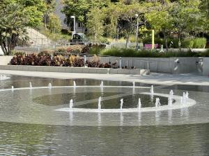 Children playing in the interactive fountain at Grand Park