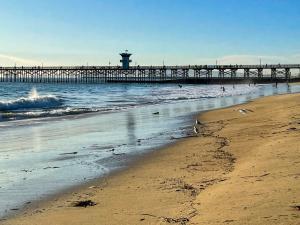 The iconic wooden Seal Beach Pier stretching into the Pacific Ocean