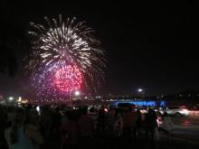 Fireworks exploding over Niagara Falls at night